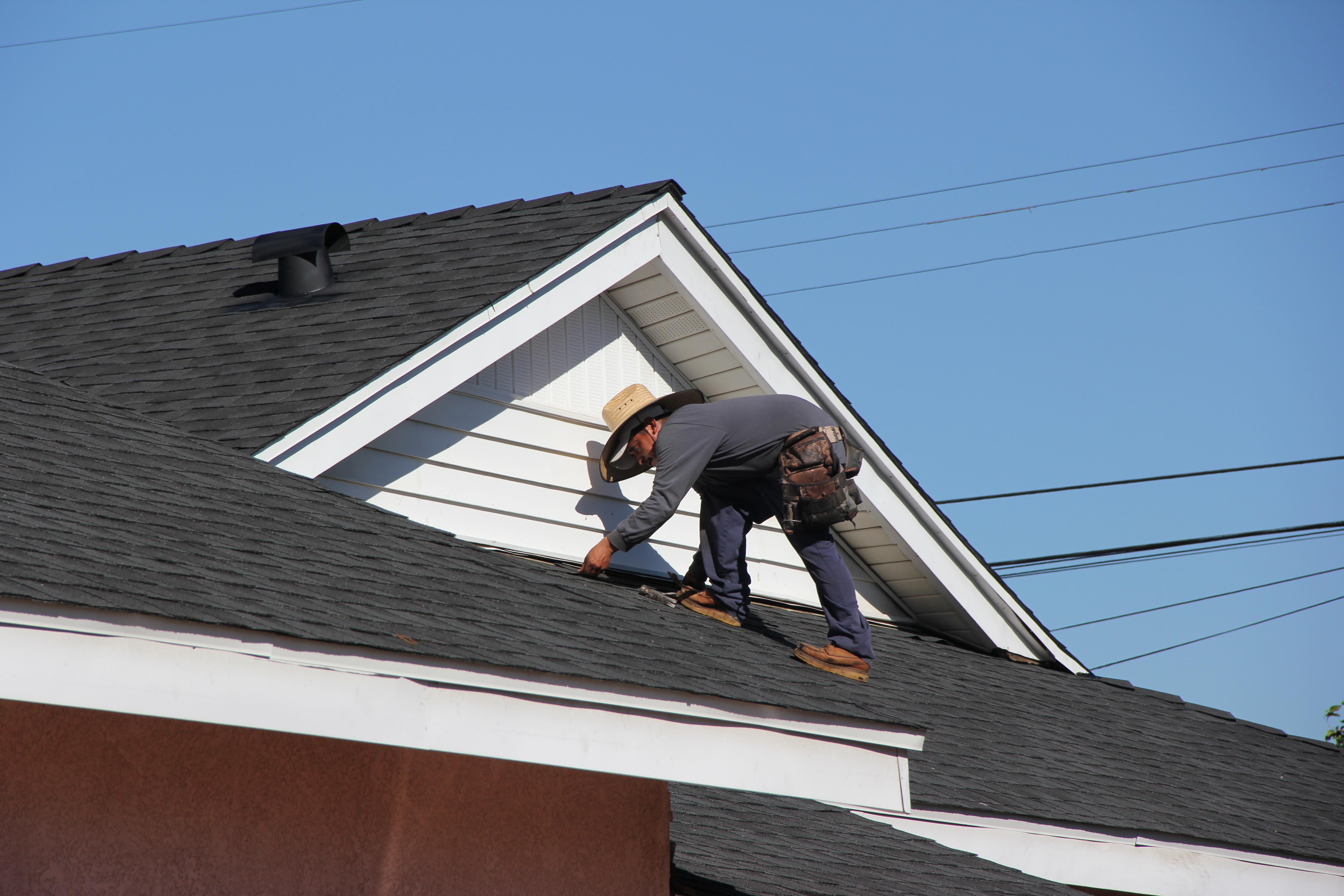 Crew installing ridge vent